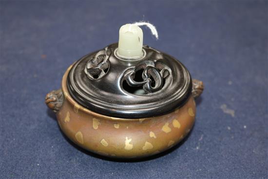 A 17th/18th century Chinese gold splashed bronze censer, Xuande mark, 19th century wood cover, jade finial H.8cm